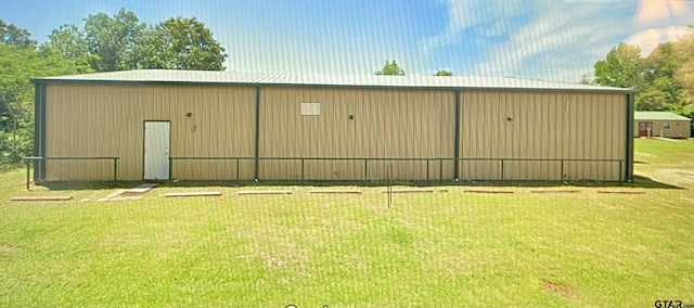 view of outbuilding with a lawn