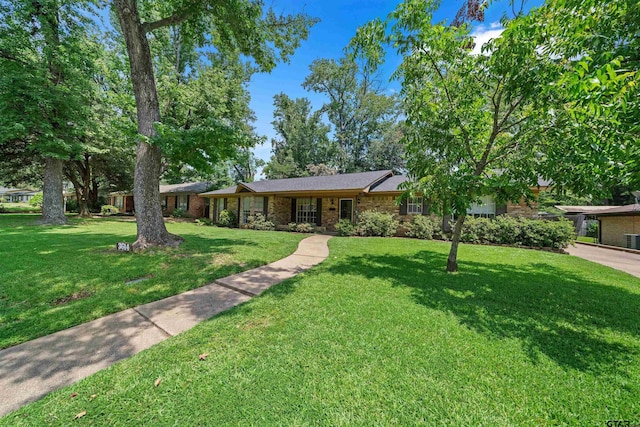 ranch-style home with a front lawn