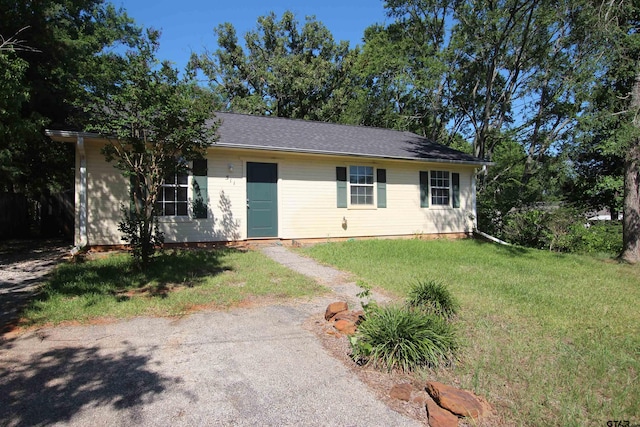 ranch-style home with a front yard