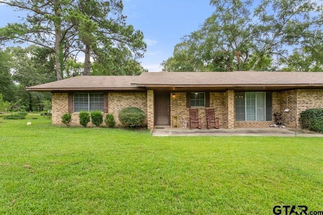 10516 Debbie Ln, Flint, TX 75762 - ranch-style house featuring a front yard and brick siding