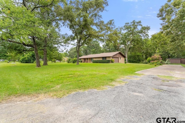 10516 Debbie Ln, Flint, TX 75762 - view of grassy yard with driveway