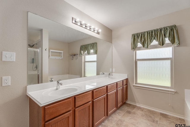 5821 Thompson Pl, Tyler, TX 75707 - full bathroom with a garden tub, double vanity, and a shower stall