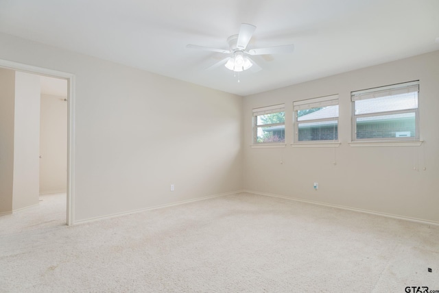 5821 Thompson Pl, Tyler, TX 75707 - empty room with light carpet and a ceiling fan