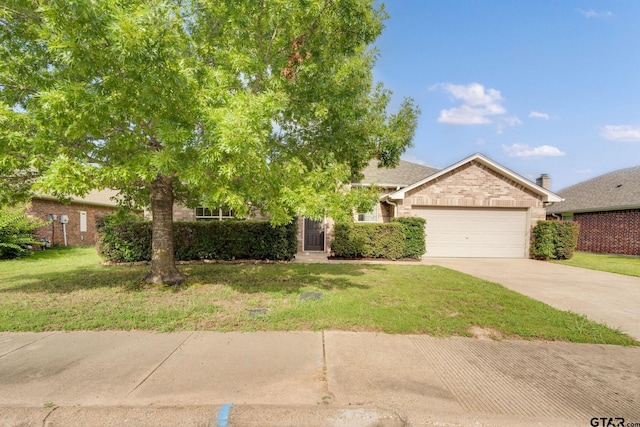 5821 Thompson Pl, Tyler, TX 75707 - obstructed view of property with a garage, concrete driveway, and a front yard