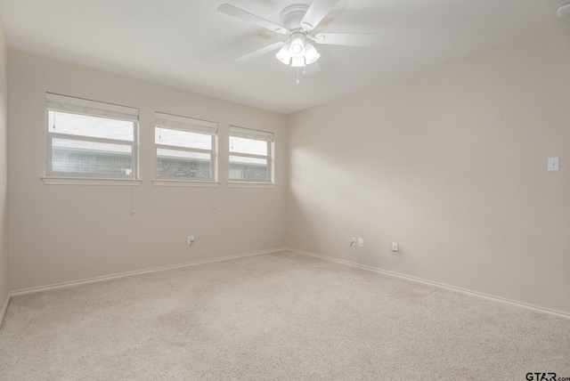 5821 Thompson Pl, Tyler, TX 75707 - carpeted empty room featuring baseboards and ceiling fan