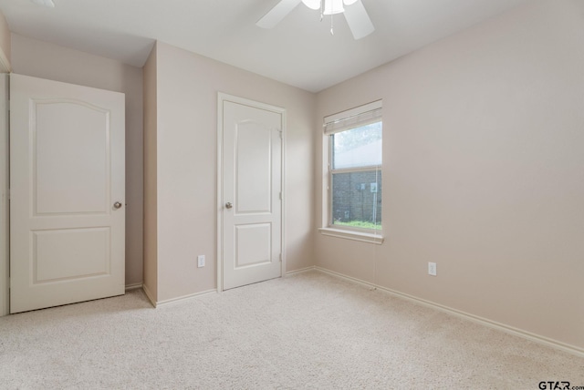 5821 Thompson Pl, Tyler, TX 75707 - unfurnished bedroom featuring carpet flooring and a ceiling fan