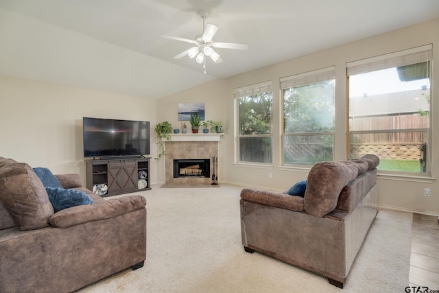 5821 Thompson Pl, Tyler, TX 75707 - carpeted living area with a fireplace, vaulted ceiling, and a ceiling fan