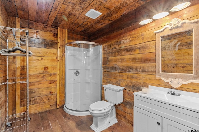 bathroom featuring toilet, a stall shower, vanity, wood finished floors, and wooden ceiling