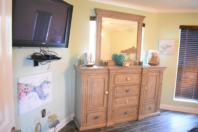details with baseboards, crown molding, and wood finish floors
