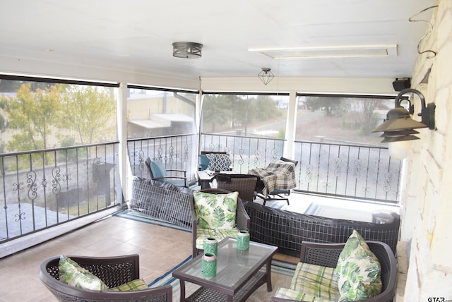 sunroom featuring an outdoor living space