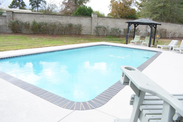 view of pool featuring a fenced in pool, fence, and a gazebo