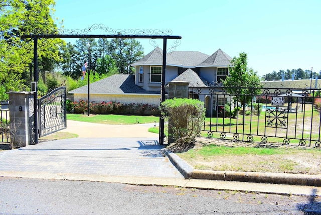 exterior space with a lawn and fence