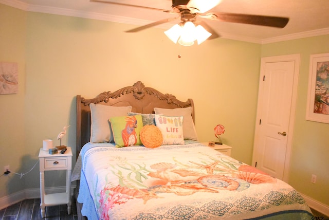 bedroom featuring baseboards, dark wood-style floors, ornamental molding, and ceiling fan