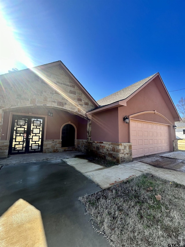 ranch-style home featuring a garage