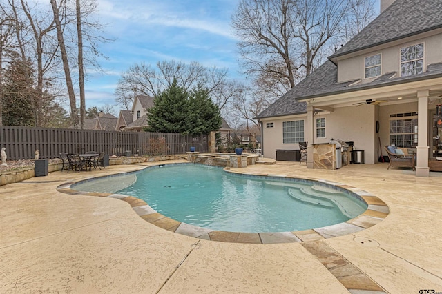 view of swimming pool featuring area for grilling, a patio, ceiling fan, a fenced backyard, and a pool with connected hot tub