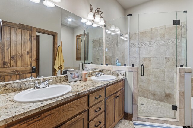 bathroom featuring a stall shower and double vanity