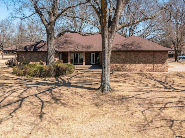 ranch-style home with brick siding