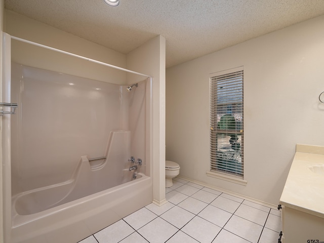 bathroom featuring tile patterned flooring, tub / shower combination, vanity, and toilet