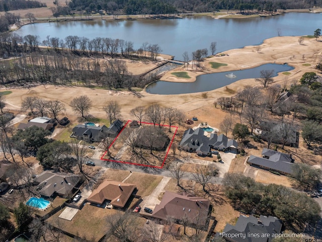 birds eye view of property featuring a water view