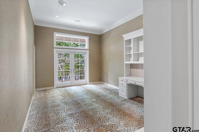 unfurnished room with french doors, built in desk, and ornamental molding