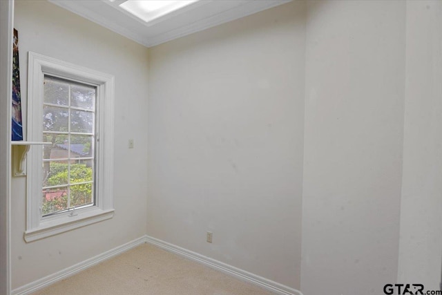 carpeted spare room with ornamental molding