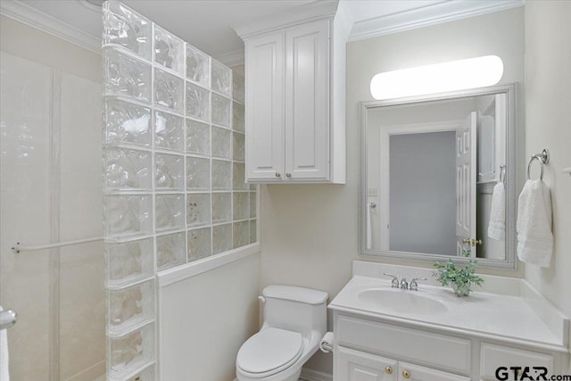 bathroom with a shower, vanity, toilet, and crown molding