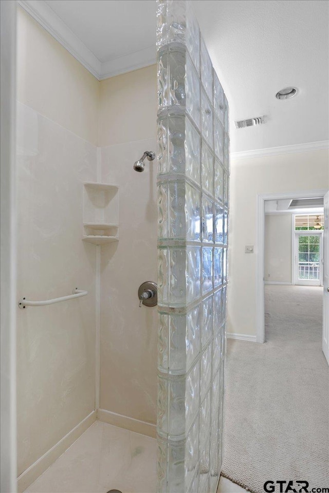 bathroom with walk in shower and crown molding