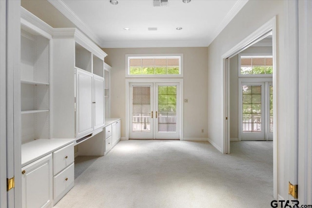 mudroom with french doors, light carpet, and ornamental molding