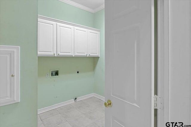 washroom with electric dryer hookup, cabinets, light tile patterned floors, washer hookup, and crown molding