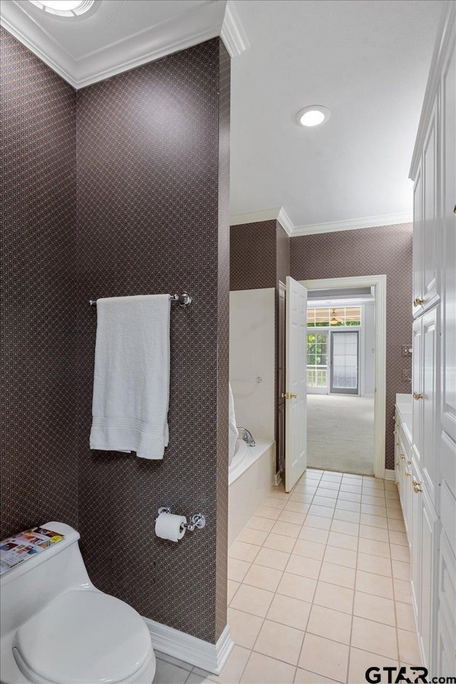 bathroom featuring ornamental molding, tile patterned floors, and toilet