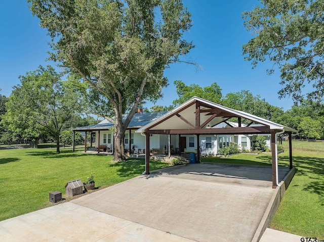 view of front of property featuring a front lawn and a gazebo