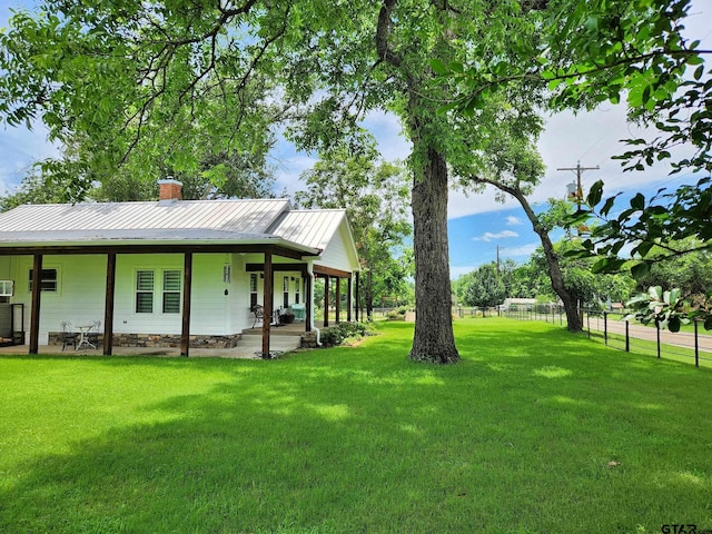 view of yard featuring covered porch