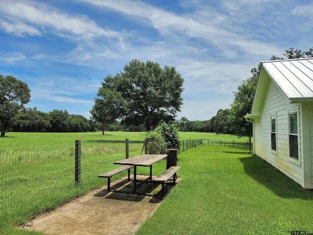 view of yard with a rural view