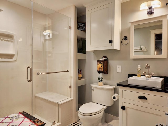 bathroom featuring walk in shower, vanity, and toilet