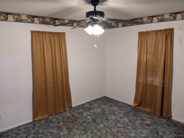 carpeted spare room featuring ceiling fan and a textured ceiling