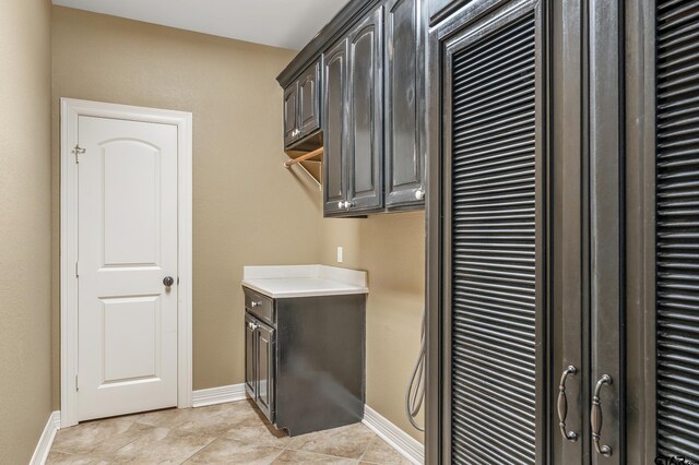 2441 Fm 2685, Gilmer, TX 75644 - laundry area with baseboards and light tile patterned floors