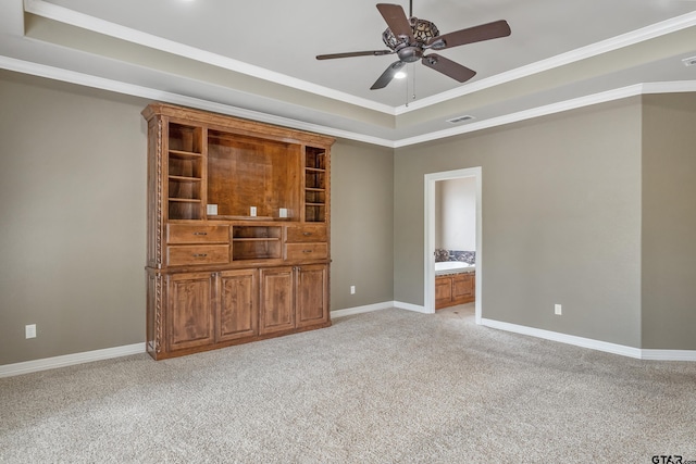 2441 Fm 2685, Gilmer, TX 75644 - spare room featuring a tray ceiling, a ceiling fan, light colored carpet, baseboards, and ornamental molding