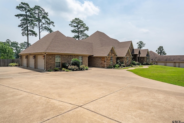 2441 Fm 2685, Gilmer, TX 75644 - view of front facade with concrete driveway and brick siding