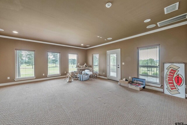 2441 Fm 2685, Gilmer, TX 75644 - living area featuring crown molding, healthy amount of natural light, baseboards, recessed lighting, and carpet floors