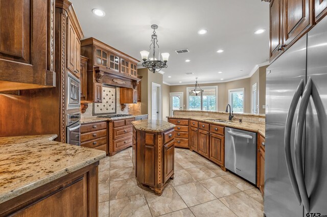 2441 Fm 2685, Gilmer, TX 75644 - kitchen with appliances with stainless steel finishes, ornamental molding, a chandelier, a sink, and light stone counters