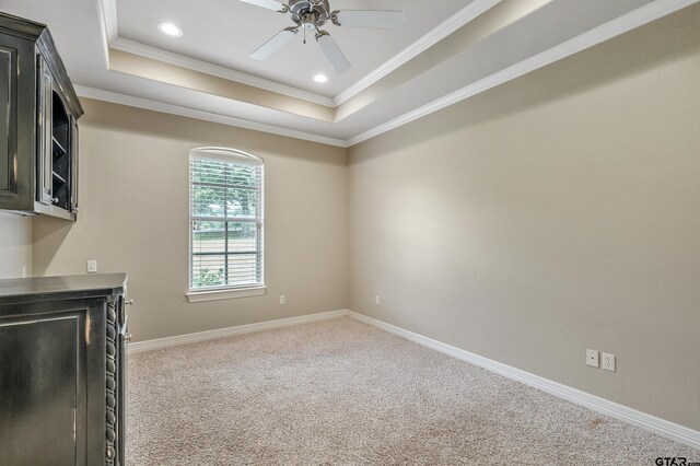 2441 Fm 2685, Gilmer, TX 75644 - unfurnished living room featuring crown molding, a raised ceiling, carpet flooring, a ceiling fan, and baseboards