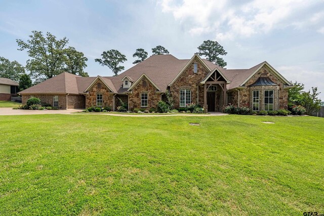 2441 Fm 2685, Gilmer, TX 75644 - view of front facade with stone siding and a front lawn