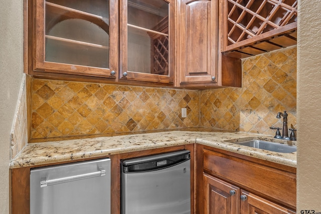 2441 Fm 2685, Gilmer, TX 75644 - kitchen with a sink, glass insert cabinets, backsplash, and light stone counters