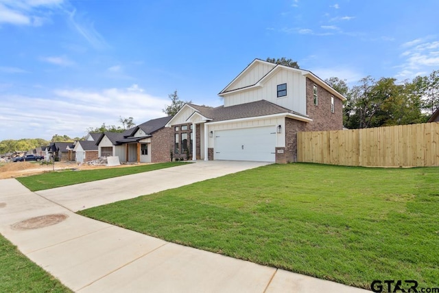 16330 Crossing Cir, Lindale, TX 75771 - view of front of home featuring board and batten siding, brick siding, and concrete driveway