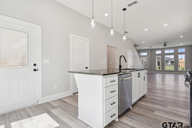 16330 Crossing Cir, Lindale, TX 75771 - kitchen with stainless steel dishwasher, light wood-type flooring, ceiling fan, open floor plan, and recessed lighting
