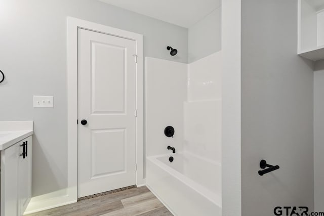 16330 Crossing Cir, Lindale, TX 75771 - bathroom with wood finished floors, vanity, and washtub / shower combination