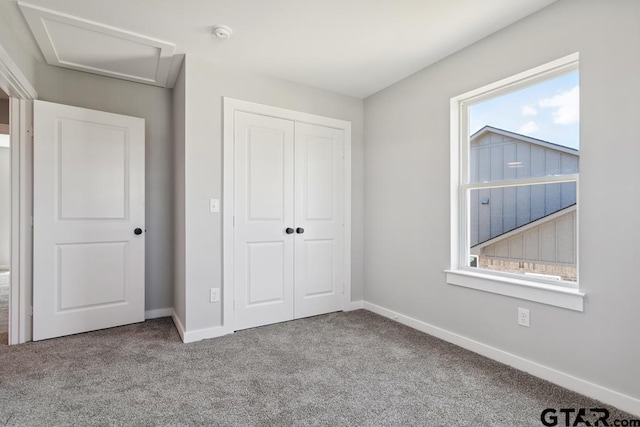 16330 Crossing Cir, Lindale, TX 75771 - unfurnished bedroom with attic access, a closet, and carpet