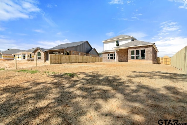 16330 Crossing Cir, Lindale, TX 75771 - rear view of property with a fenced backyard and brick siding