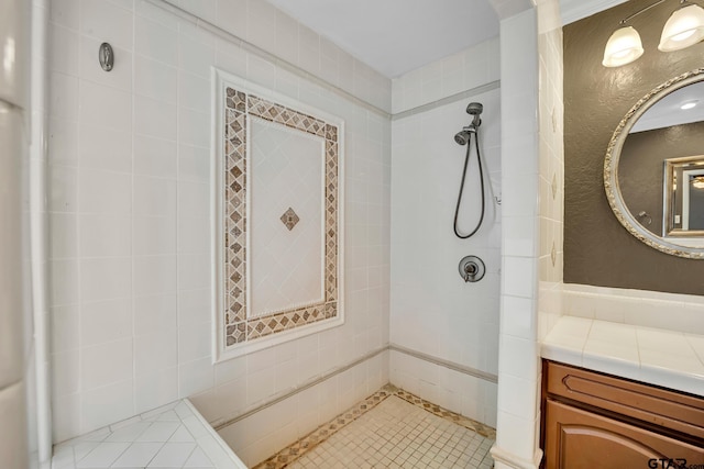 386 Fm 1711, Jacksonville, TX 75766 - bathroom with tiled shower, vanity, and tile patterned flooring