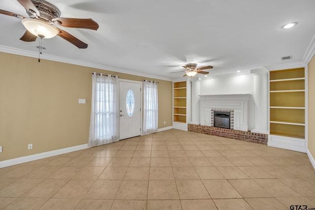 386 Fm 1711, Jacksonville, TX 75766 - unfurnished living room with ceiling fan, ornamental molding, visible vents, baseboards, and built in shelves